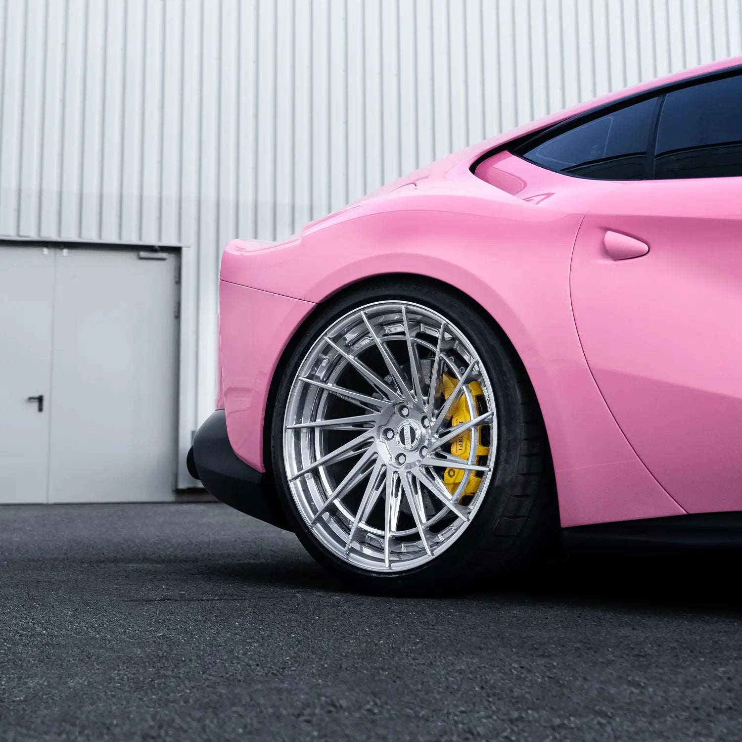 Ferrari 812 Superfast rear angle showing Radi8 2-piece forged silver wheels – 23 inch